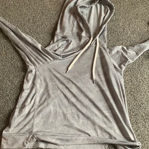 A long sleeve shirt with a hood. A good running shirt